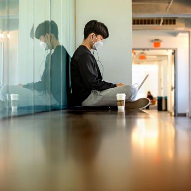 A student working in a hallway